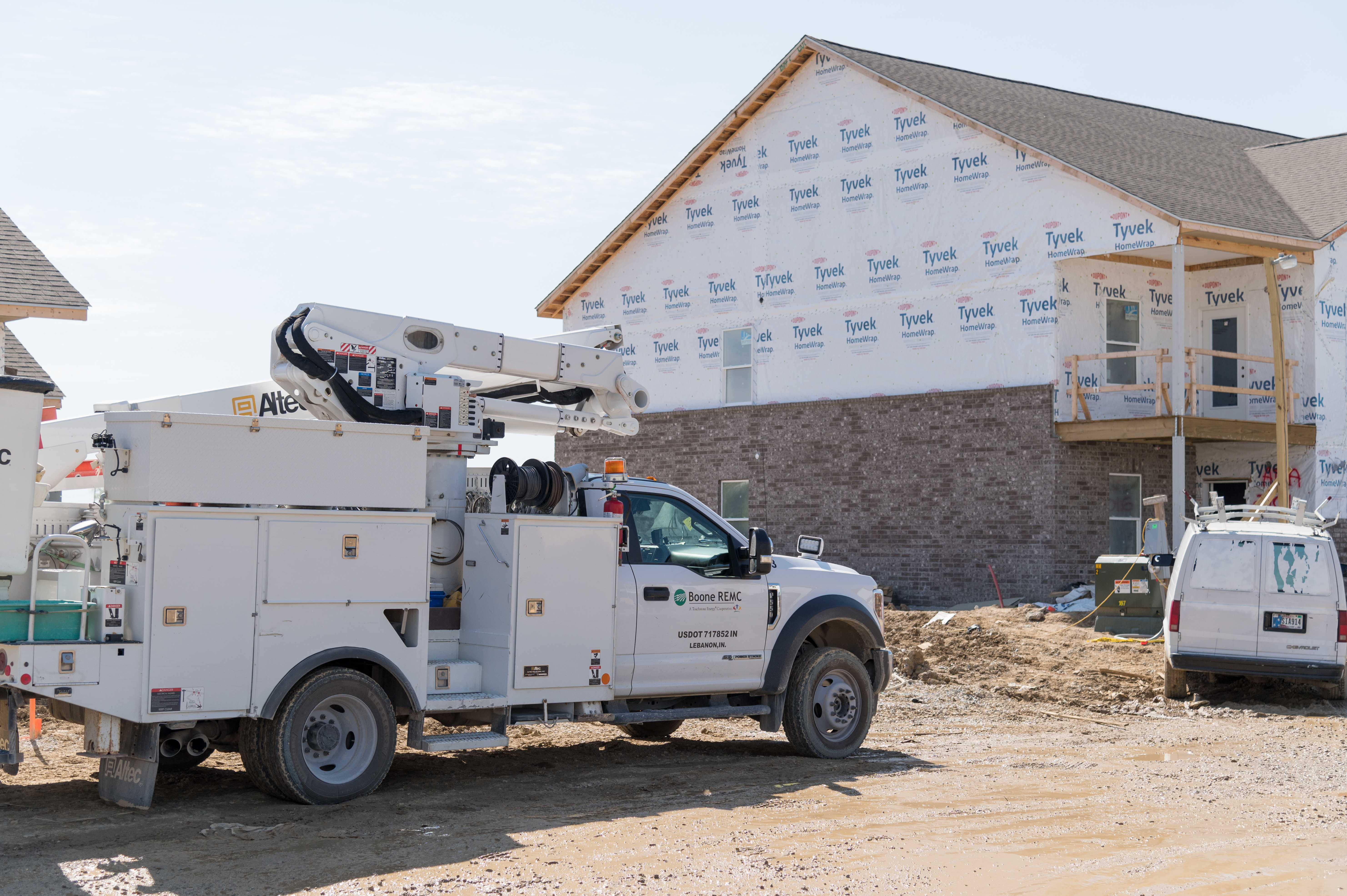 new house with bucket truck